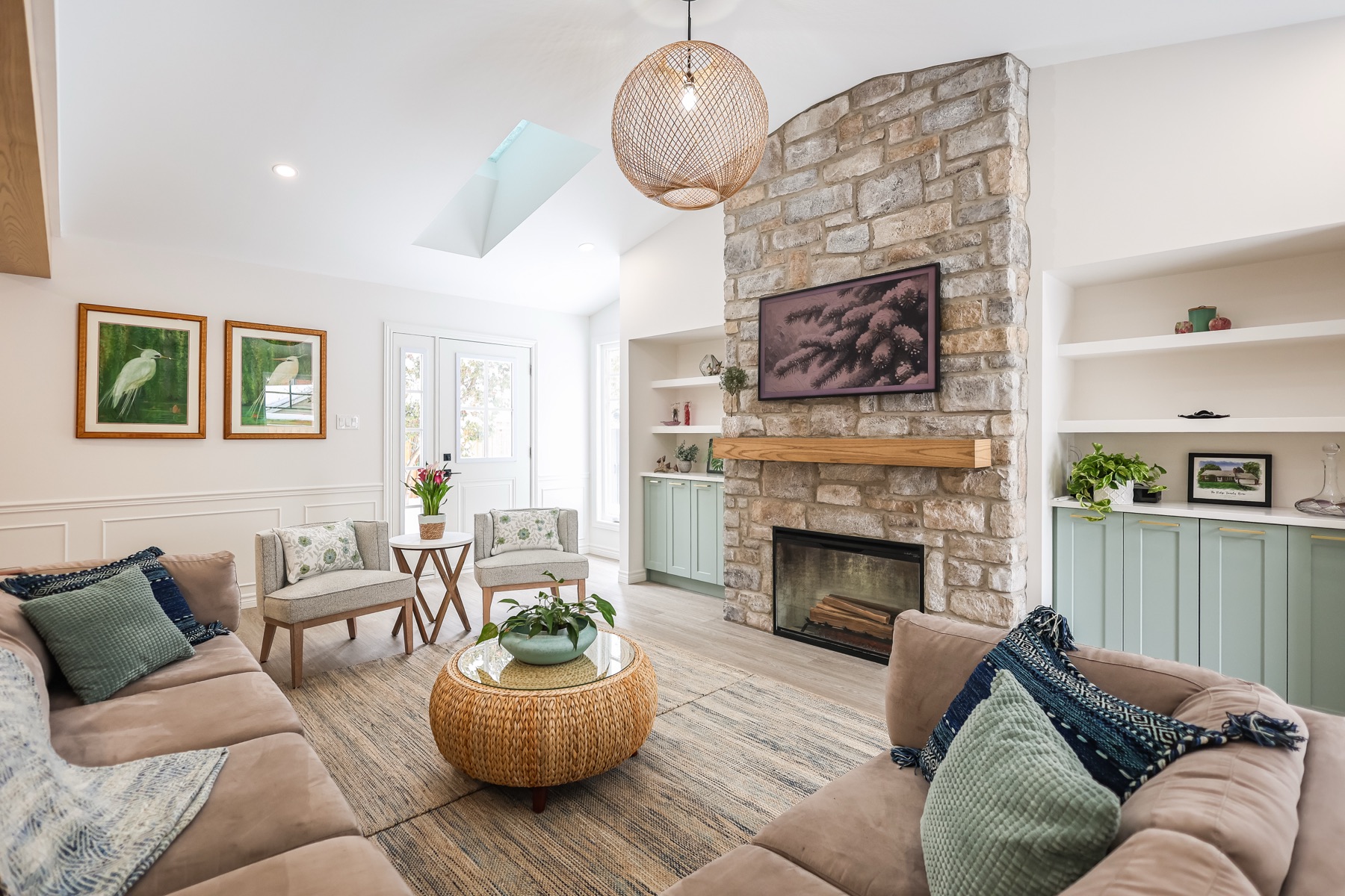 Redhaven living room with layered neutral textiles, natural light, and warm wood furniture