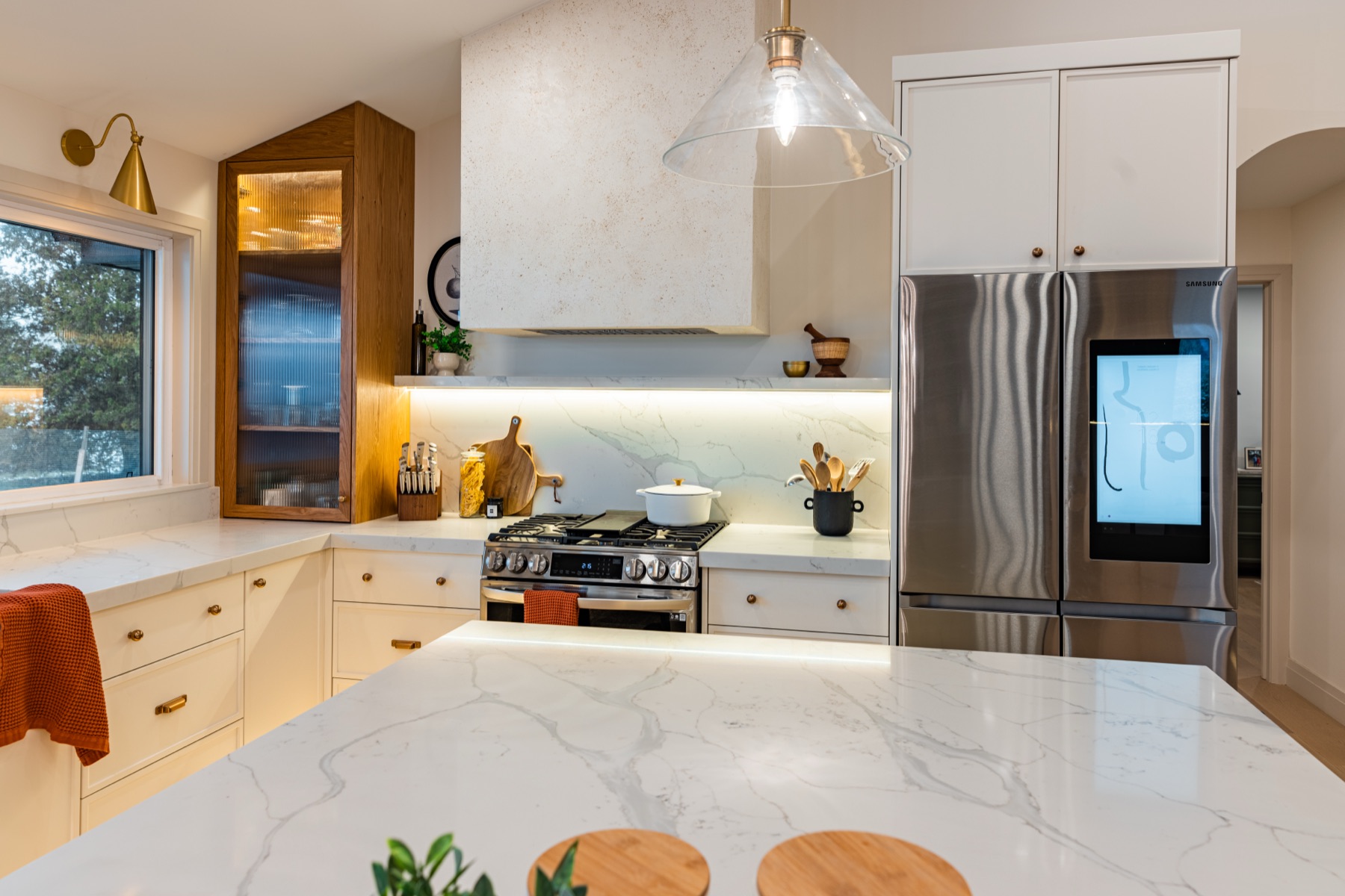 Warm brass fixtures and finish pairing in The Whitehouse kitchen
